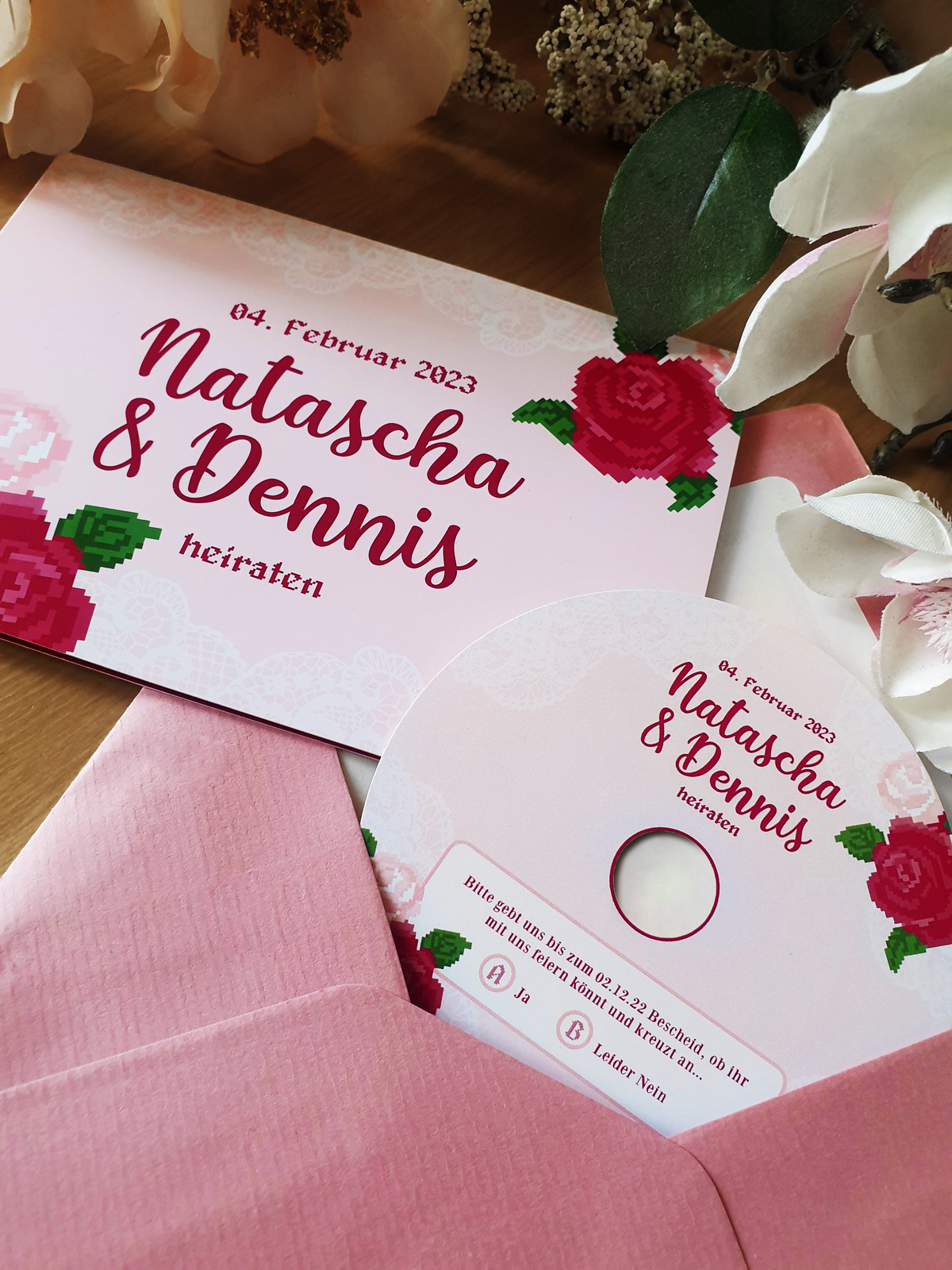 pink Wedding Invitation for Natascha and Dennis with pixelated roses