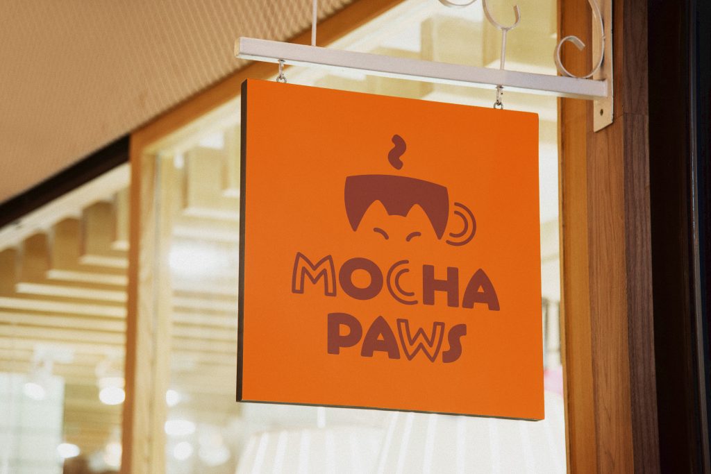 Mocha Paws orange Sign over the Entrance with the Logo in brown color