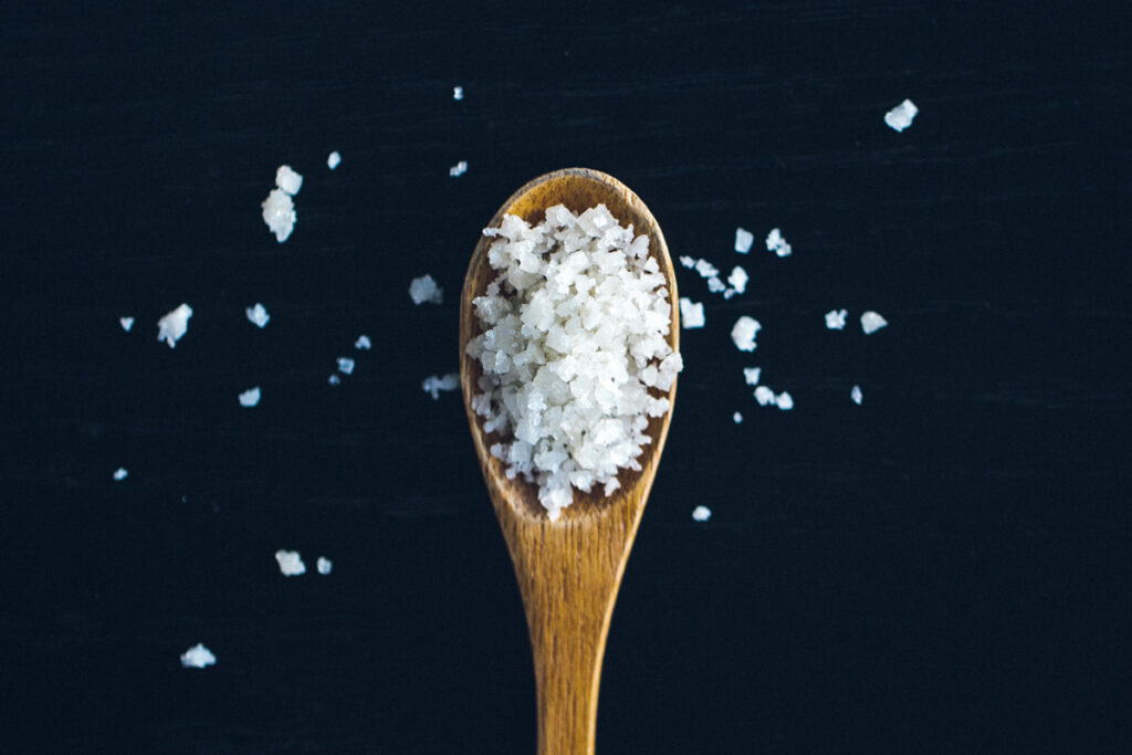 chunky salt on a wooden spoon