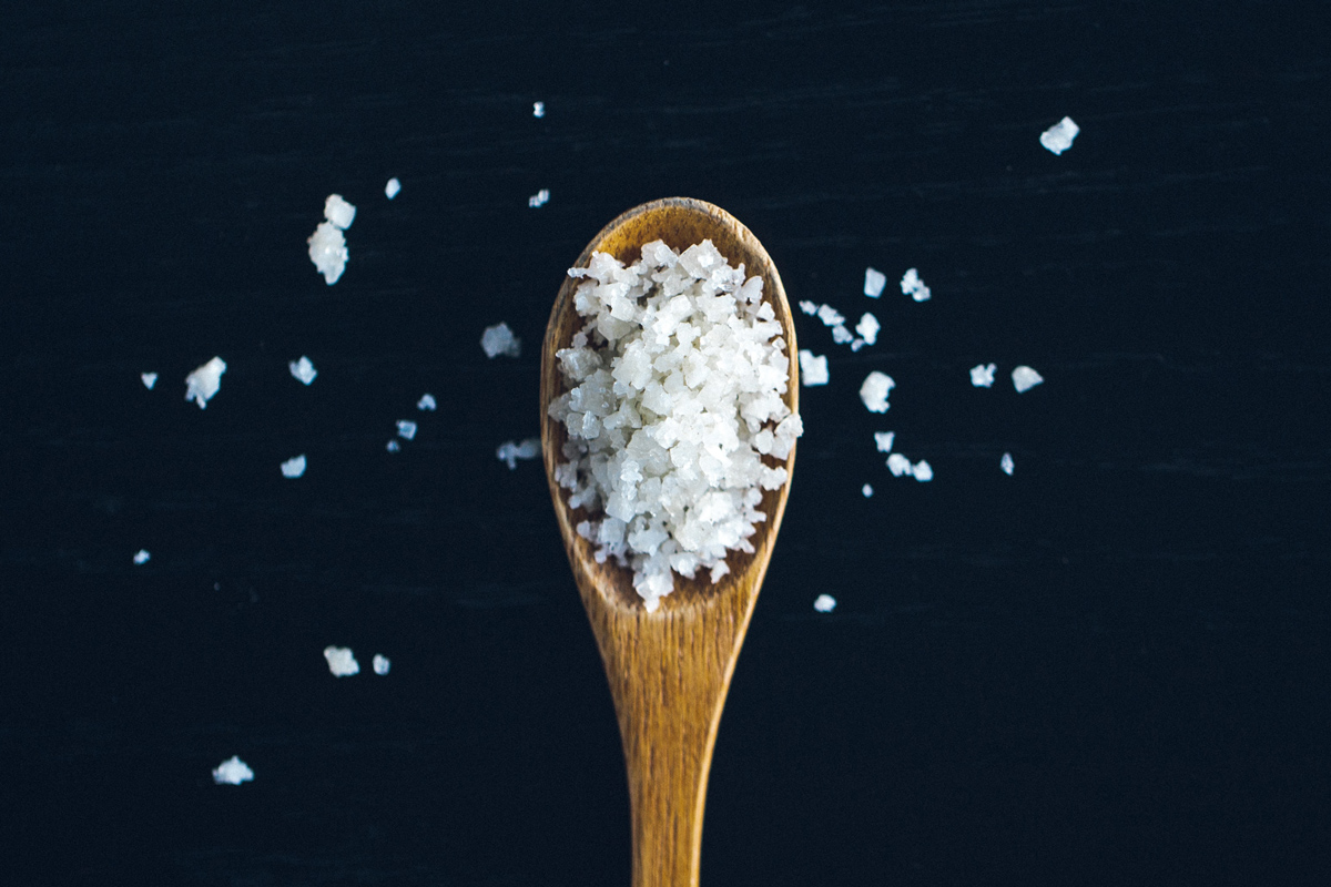 chunky salt on a wooden spoon