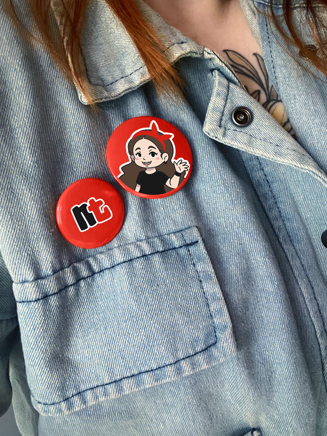 jeans jacket with two buttons: one with the font from Natascha's Logo and the other with the stylized chibi-character