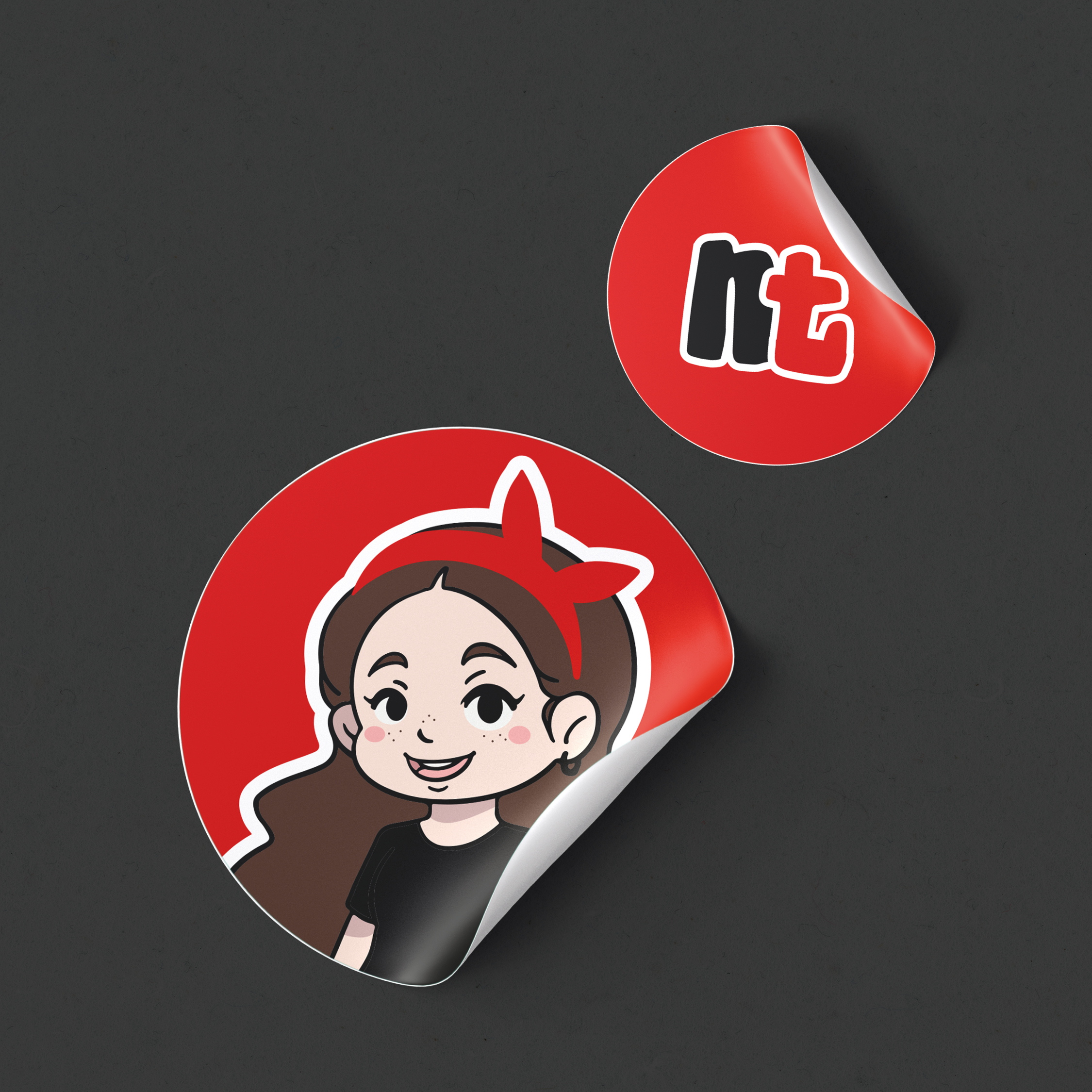 two stickers are shown: one with the font from Natascha's Logo and the other with the stylized chibi-character